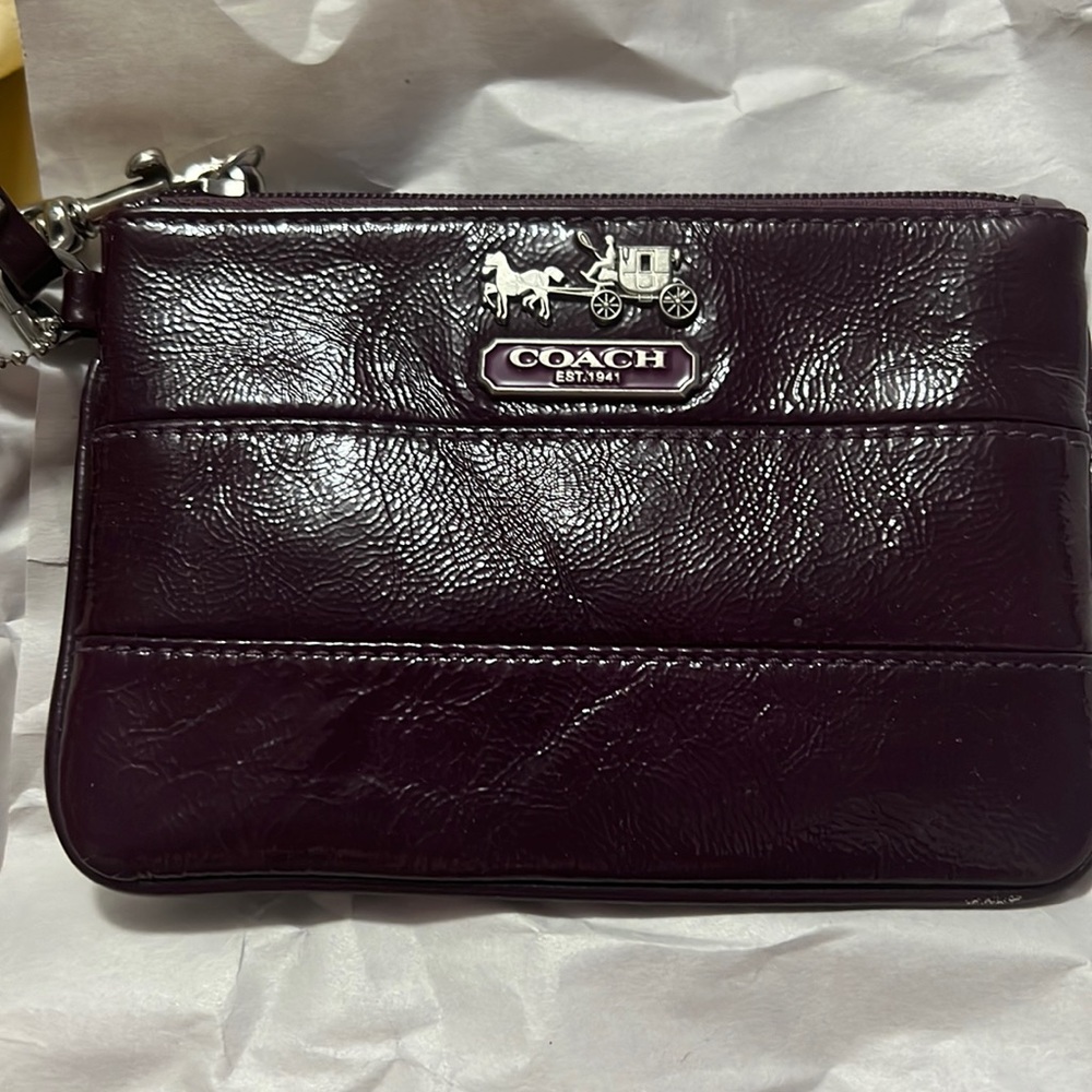 Wine colored coach wristlet..like new